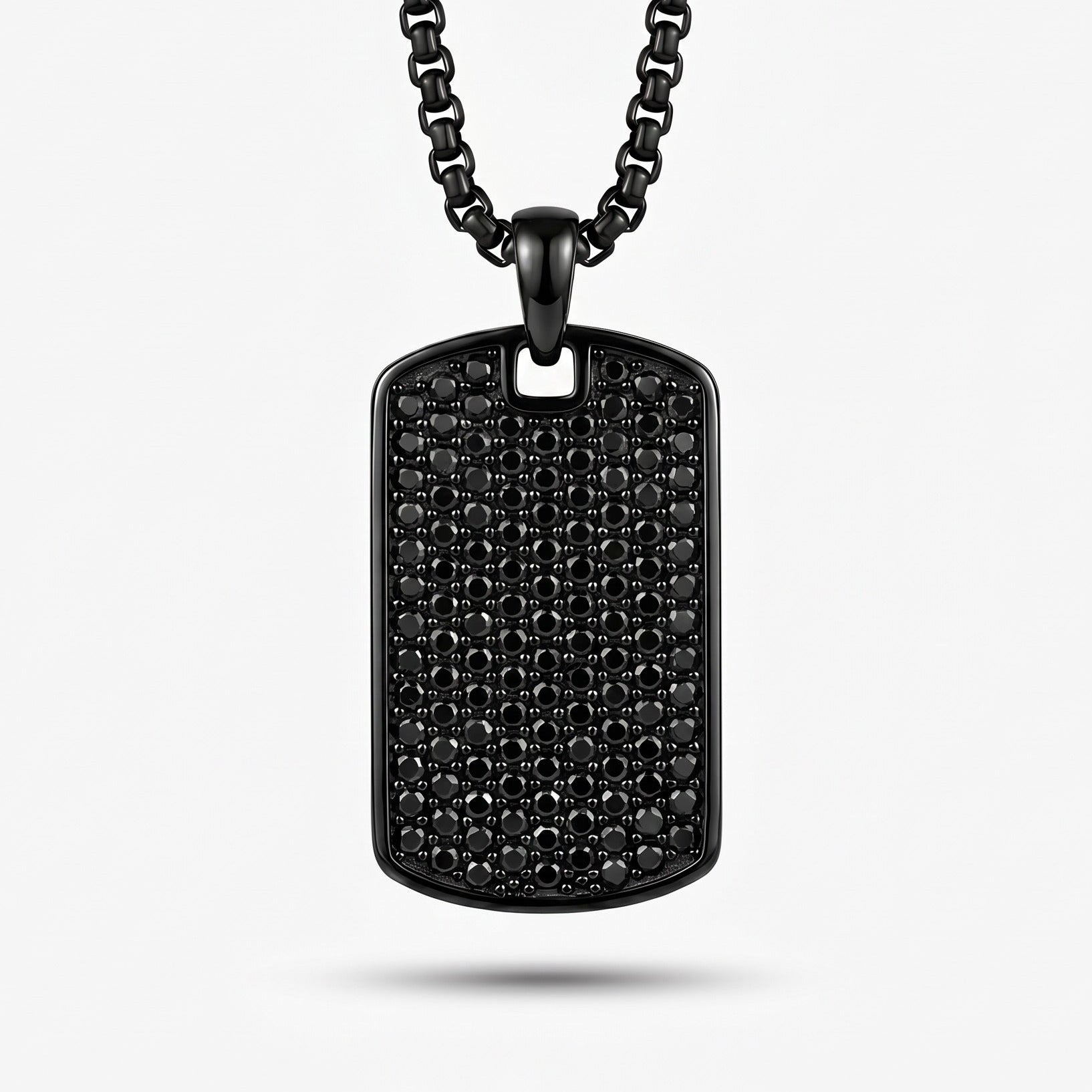 Black dog tag necklace on a white background