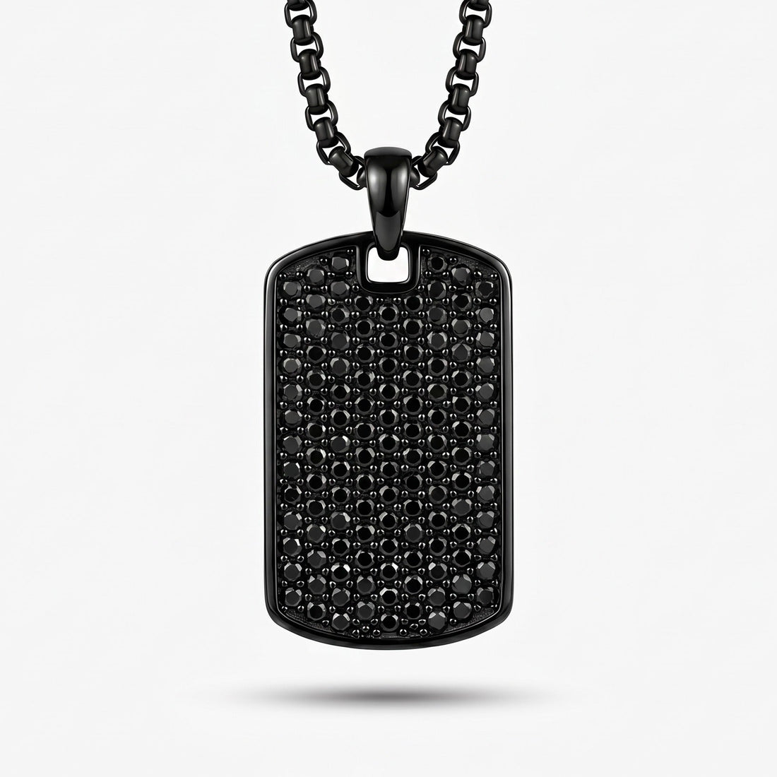 Black dog tag necklace on a white background