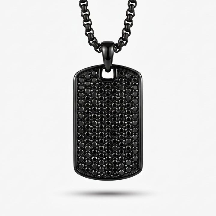 Black dog tag necklace on a white background
