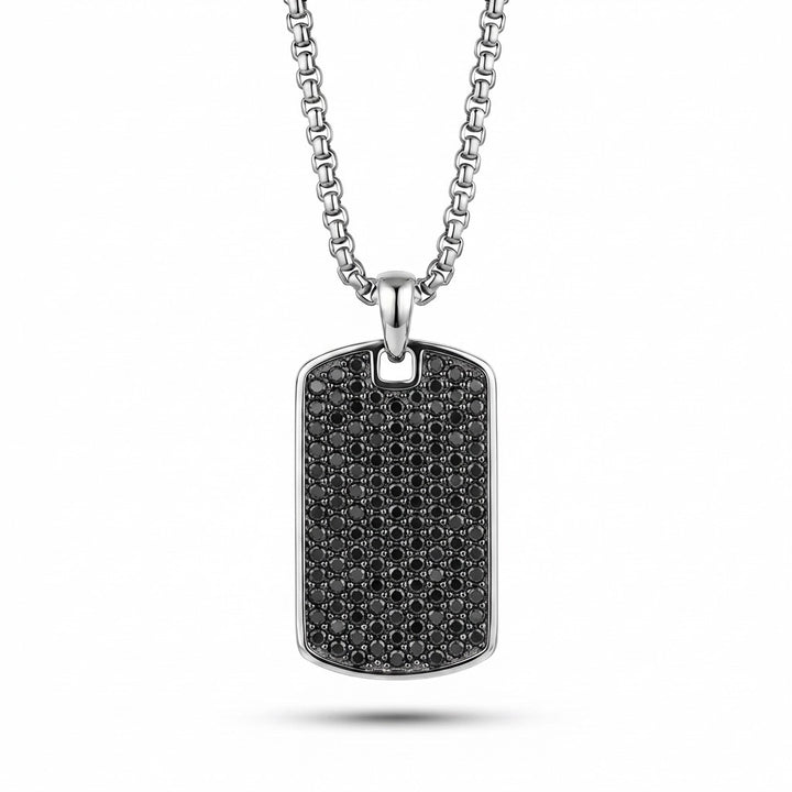 Necklace with a black diamond-studded dog tag on a white background
