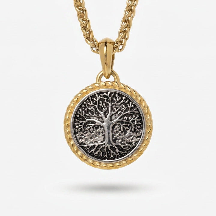 Gold necklace with a tree-of-life pendant on a white background