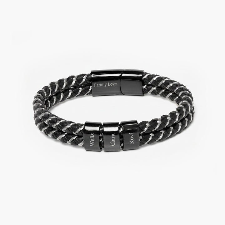 Black braided bracelet with engraved name charms on a white background
