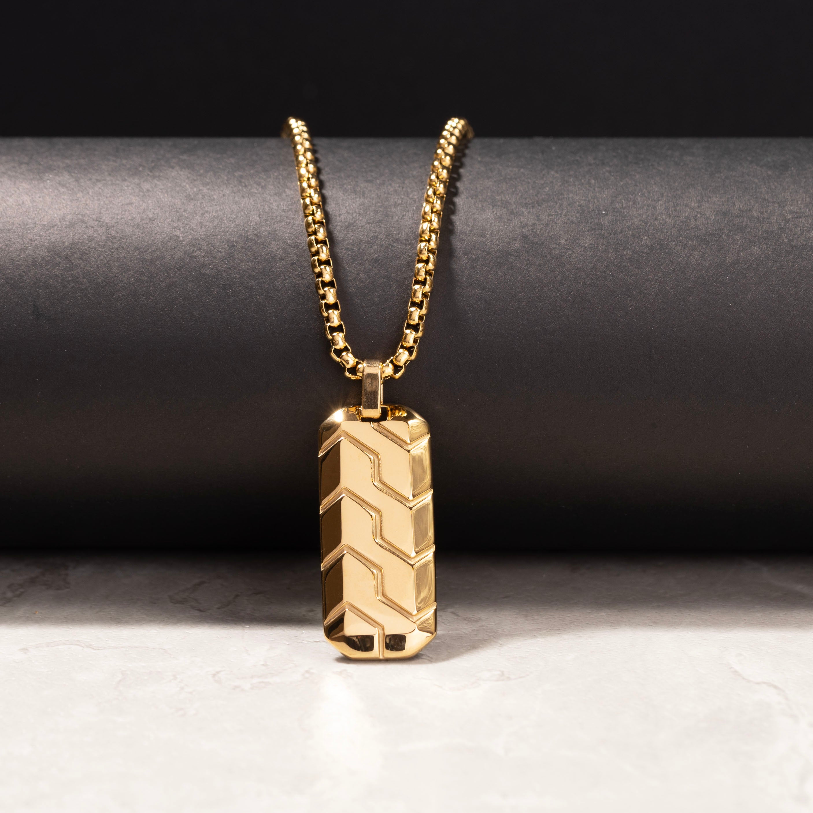 Men’s personalized jewelry with engraved text on a sleek pendant
