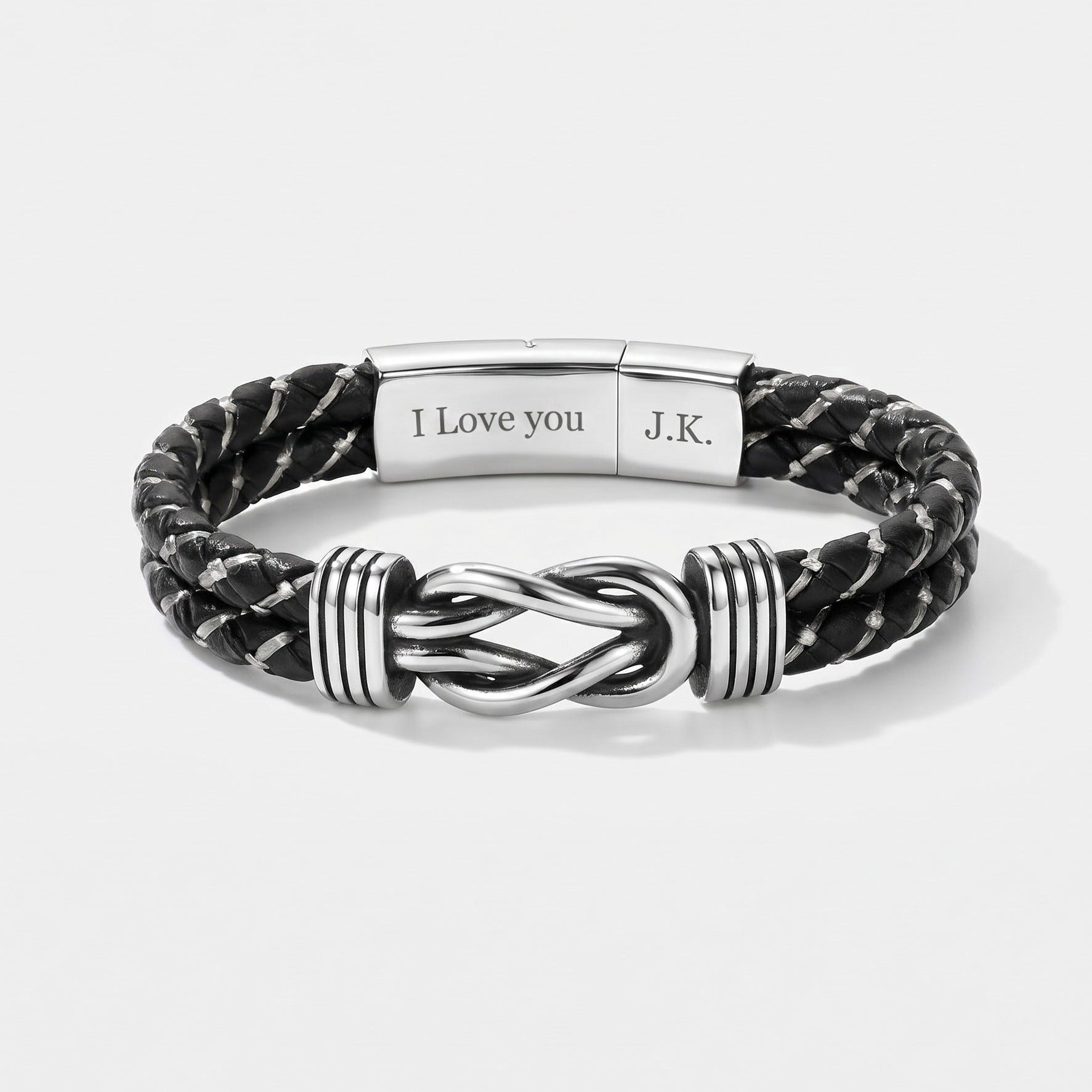Black braided leather bracelet with silver knot design on a white background