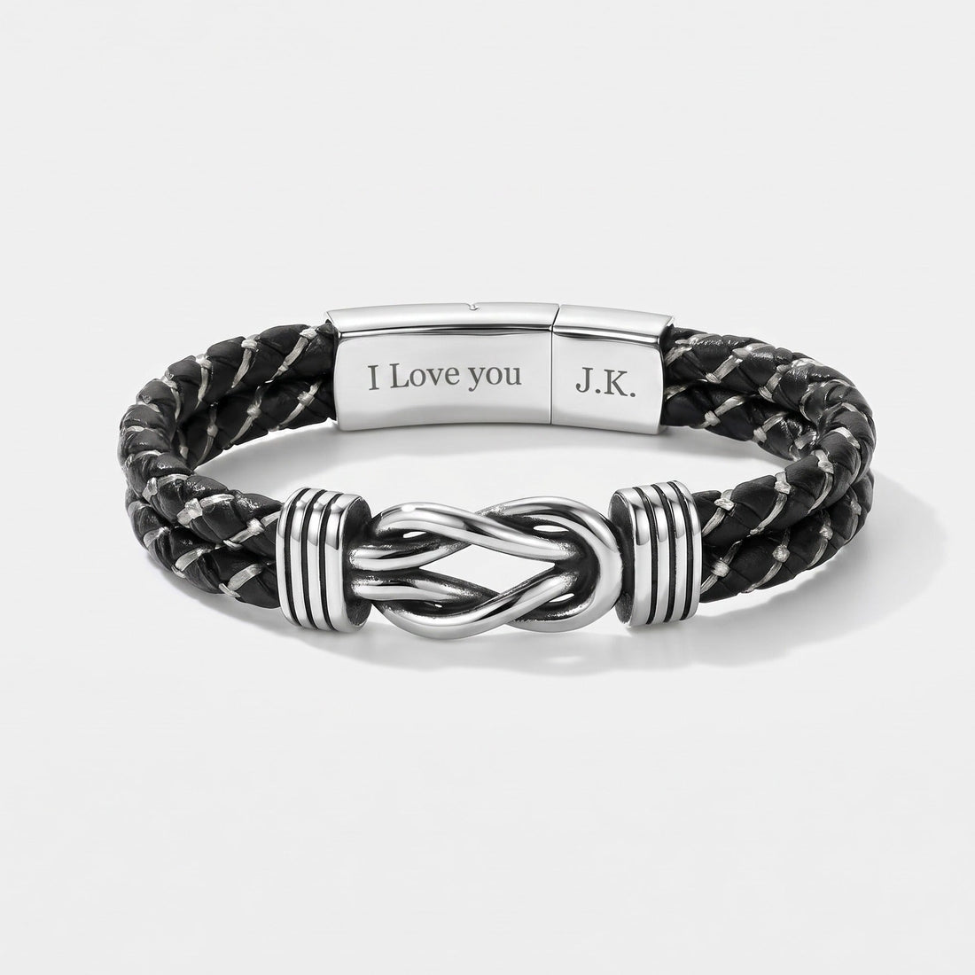 Black braided leather bracelet with silver knot design on a white background