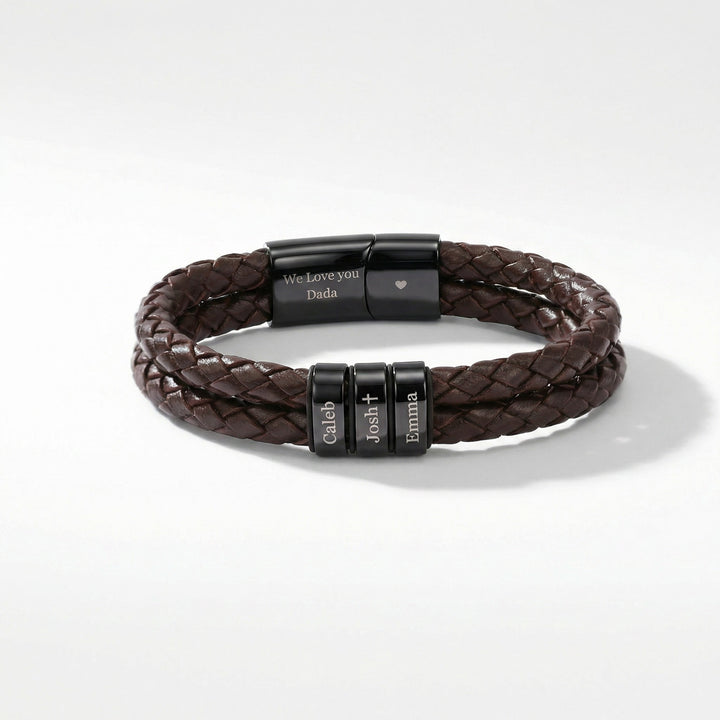 Brown braided leather bracelet with engraved black metal beads on a white background
