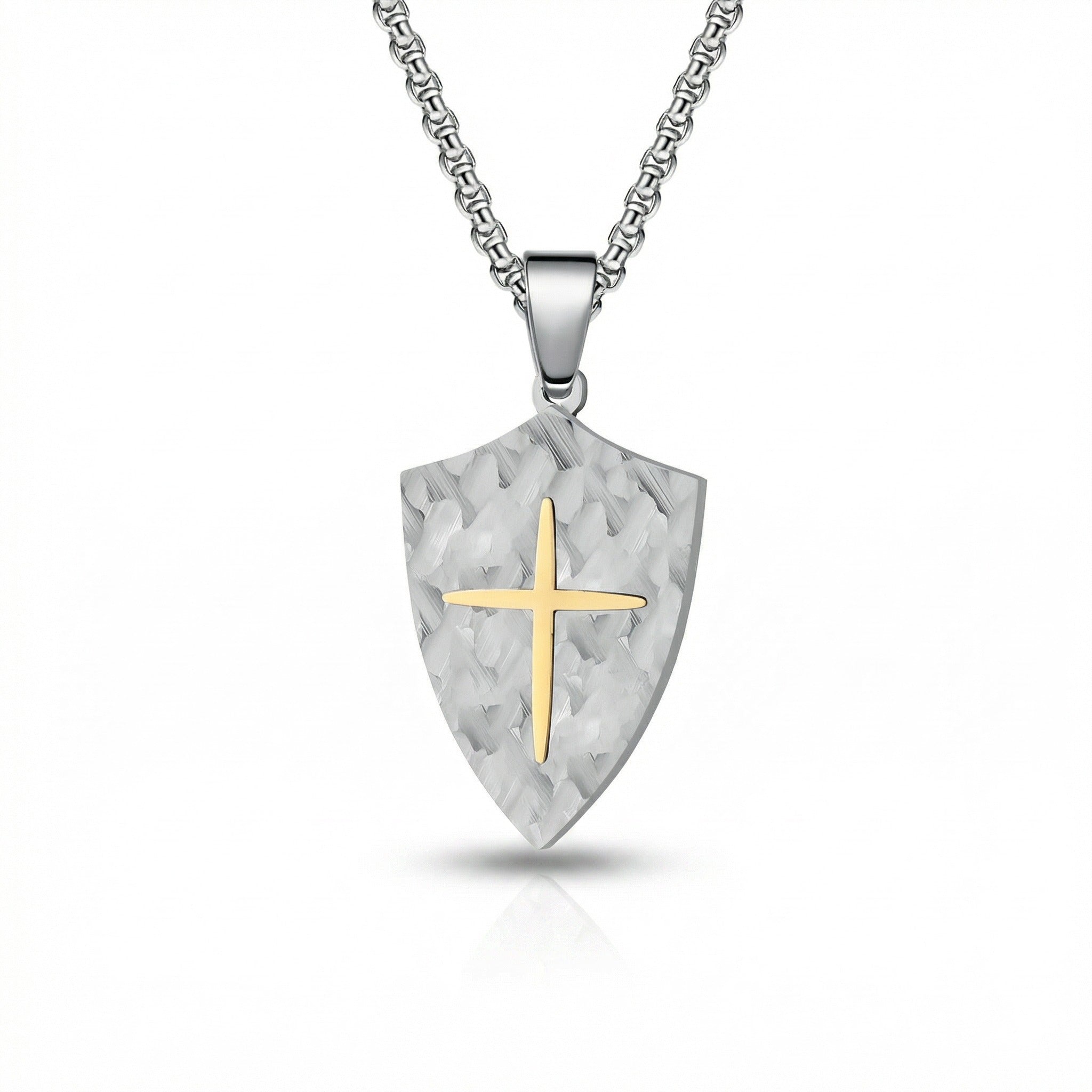 Shield-shaped pendant with a gold cross on a white background