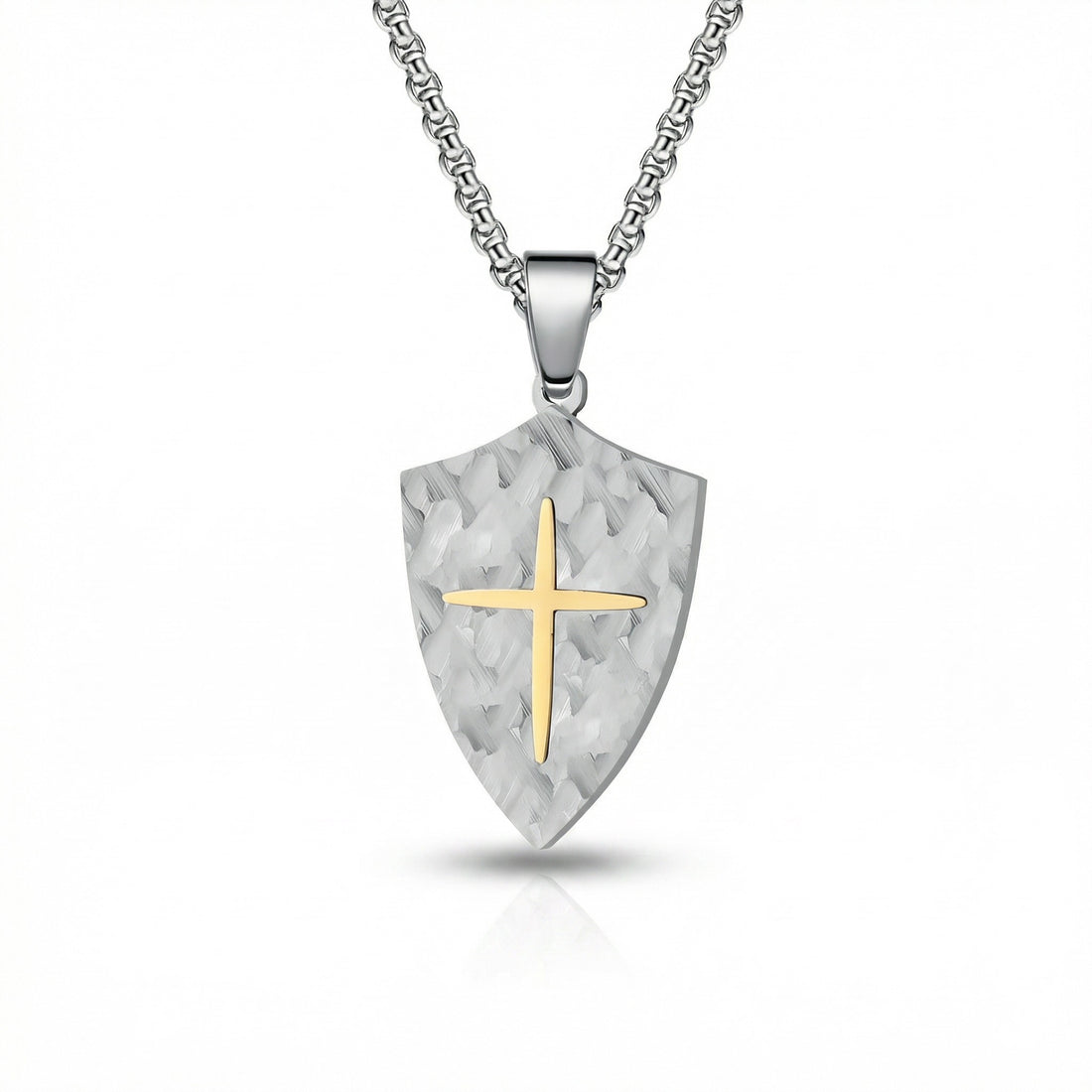 Shield-shaped pendant with a gold cross on a white background