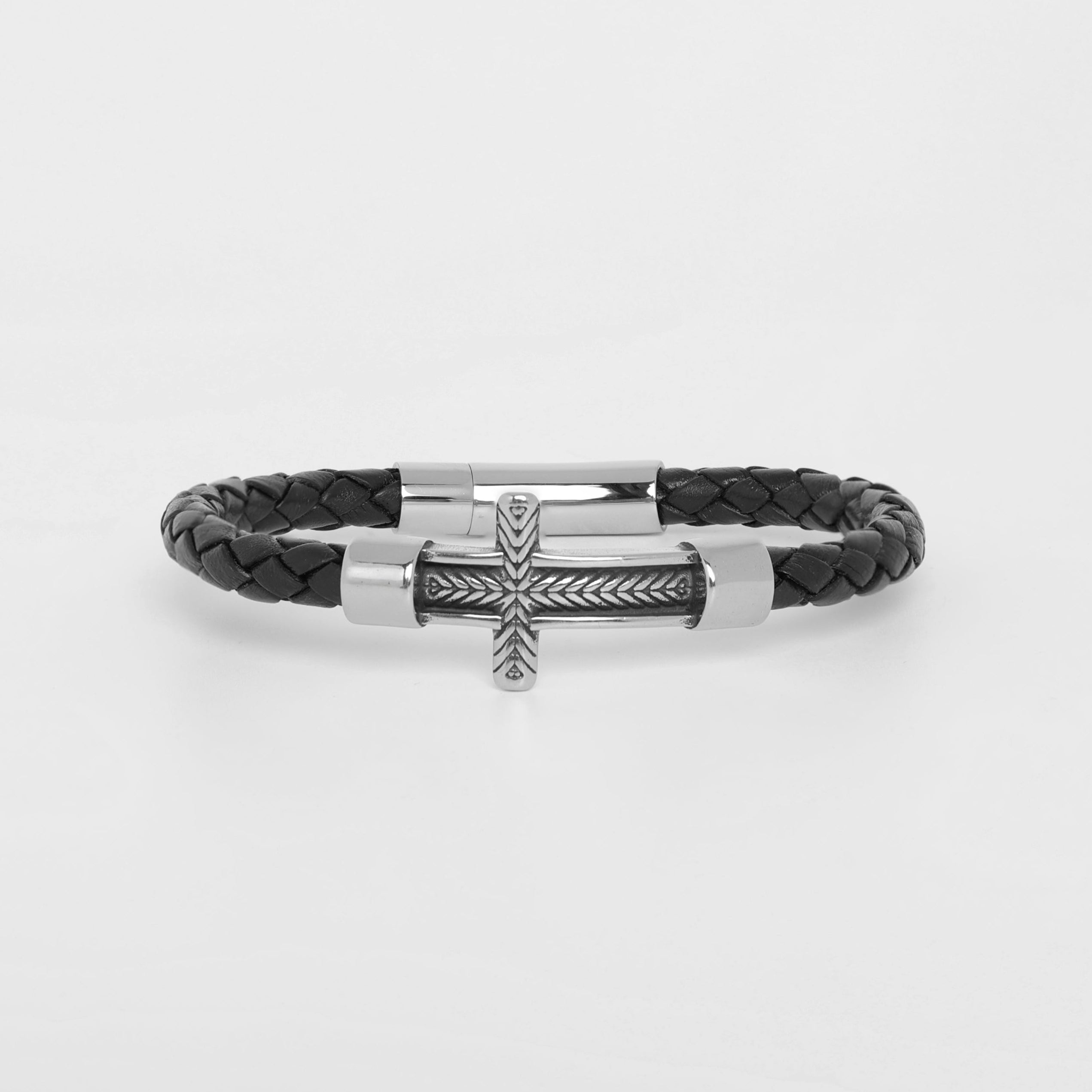 A black braided leather bracelet with a silver-toned metal cross clasp, shown on a clean white background.