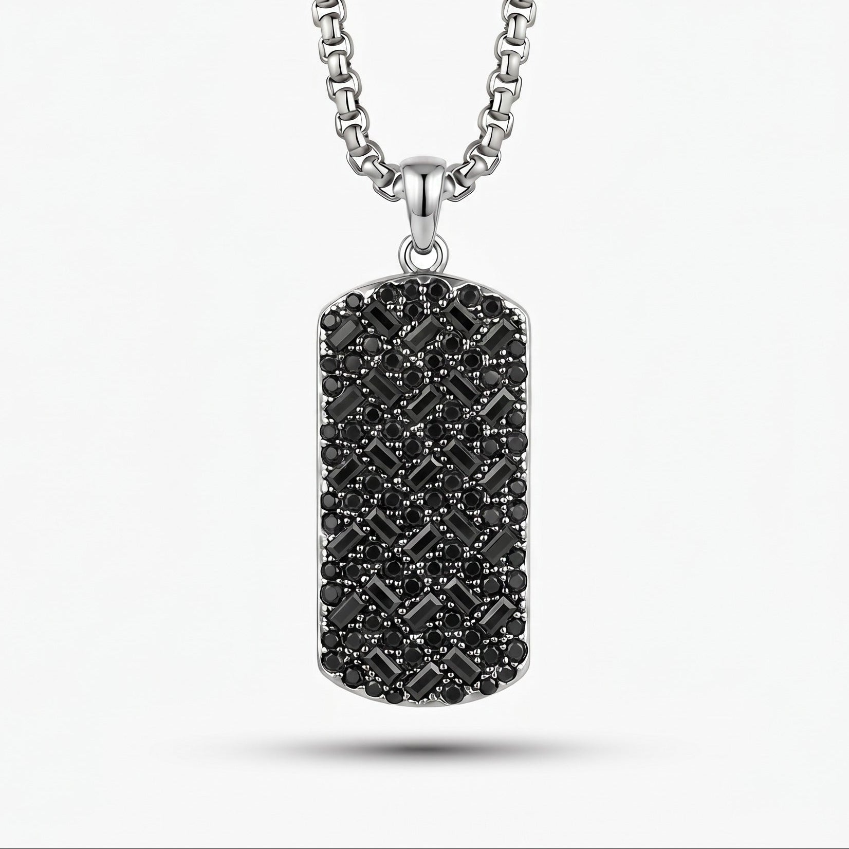Titanium-necklace with a black diamond-studded pendant on a white background