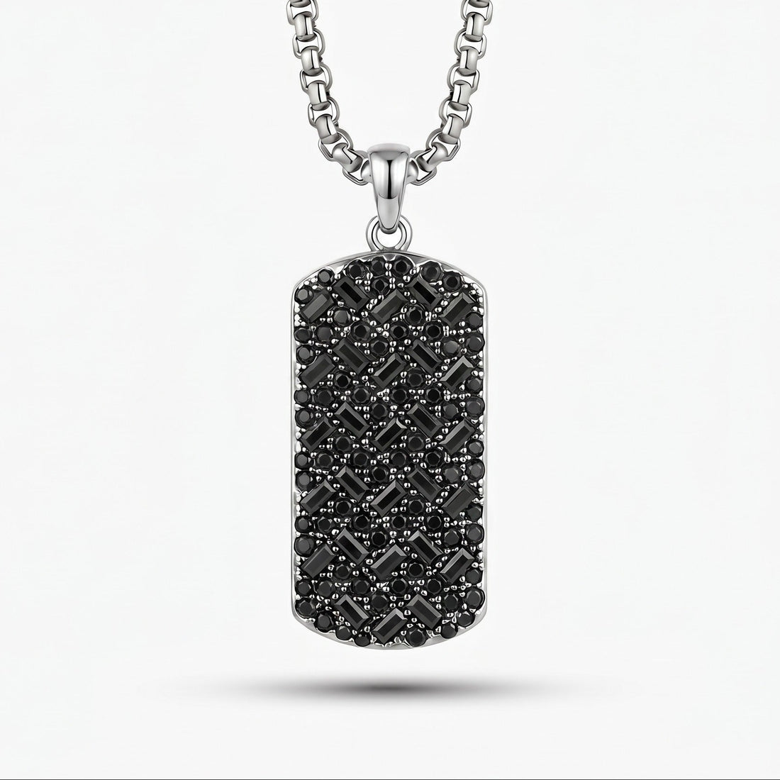 Titanium-necklace with a black diamond-studded pendant on a white background