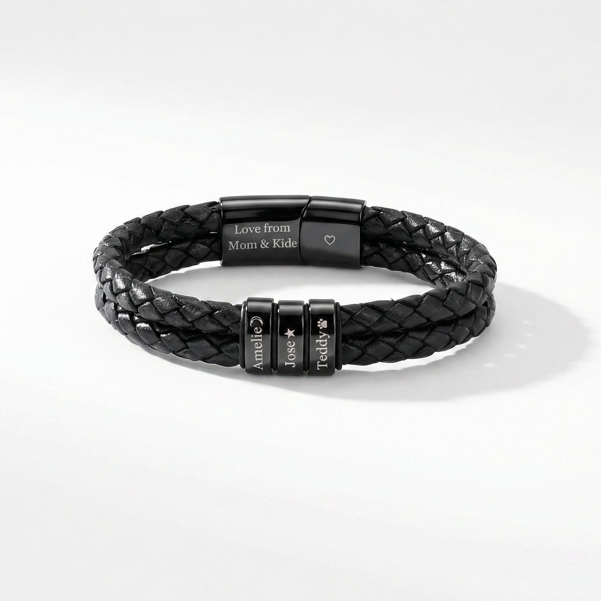 Black braided leather bracelet with engraved metal tags on a white background