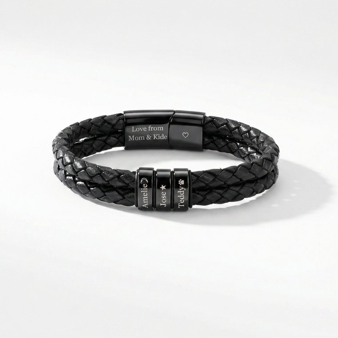 Black braided leather bracelet with engraved metal tags on a white background