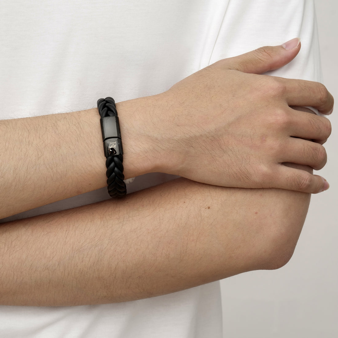 men wearing a custom leather bracelet for men, gold initials, meaningful gift for him