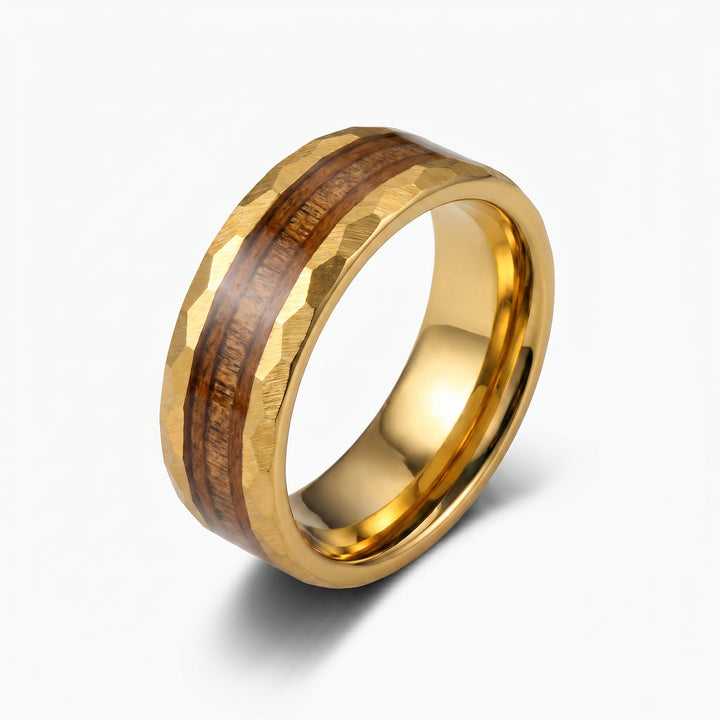 gold wedding band ring on white background