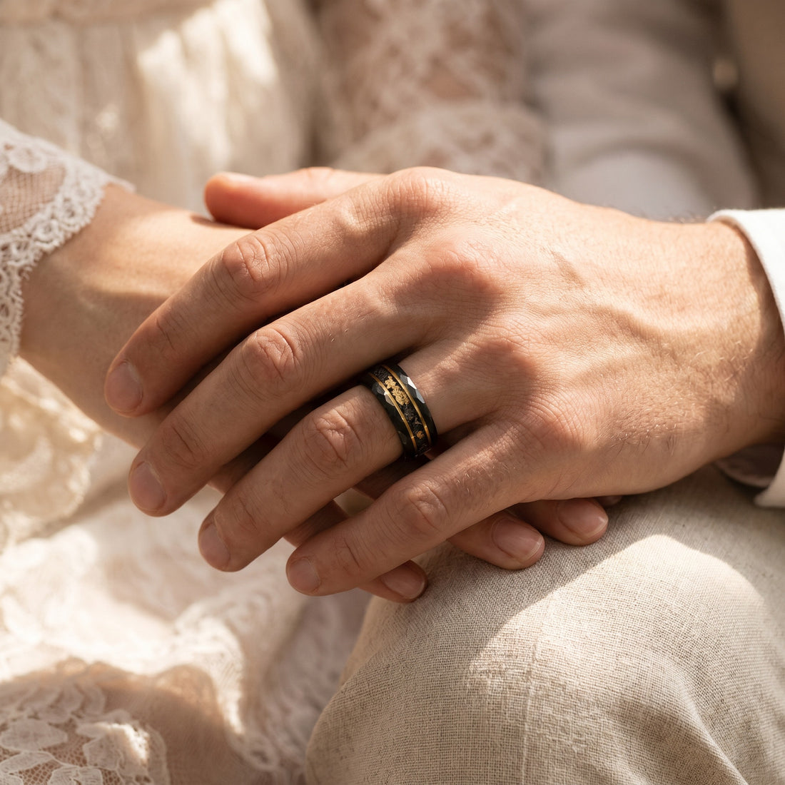 Close-up of hands with a gold ring on a soft background