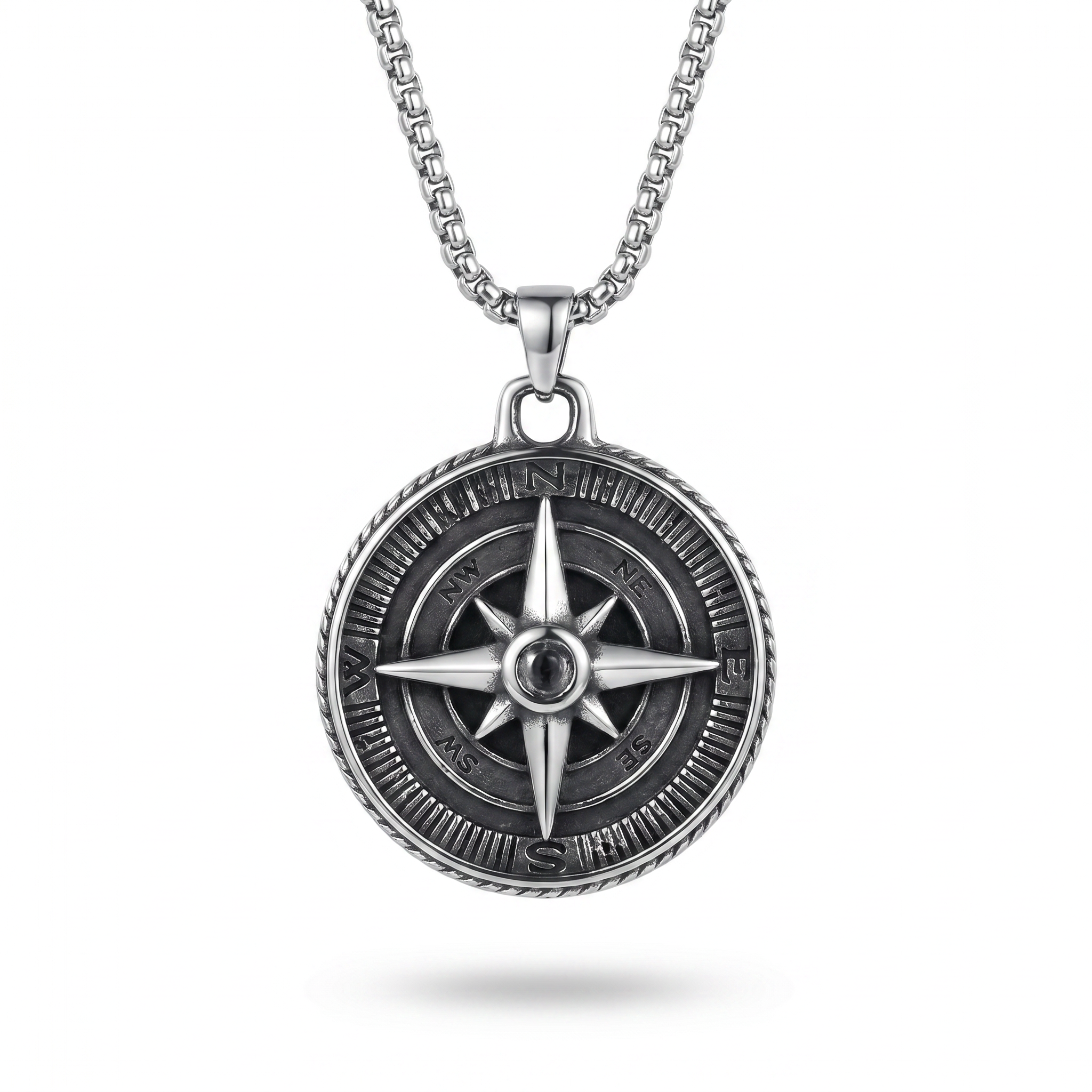 Silver compass pendant necklace on a white background