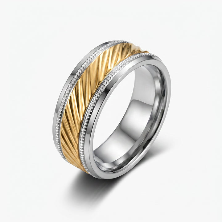 Two-tone ring with gold and silver design on a white background